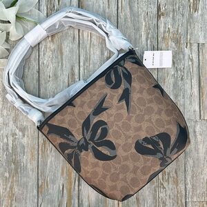 Coach City Bucket Bag Crossbody In Signature Canvas With Bow Print Purse